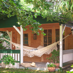Cream LA SIESTA Bossanova Latte Brazilian hammock hanging on a covered garden porch