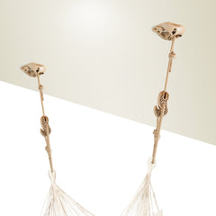 Two beige CasaMount mounts fixed near a wall corner, holding a hammock