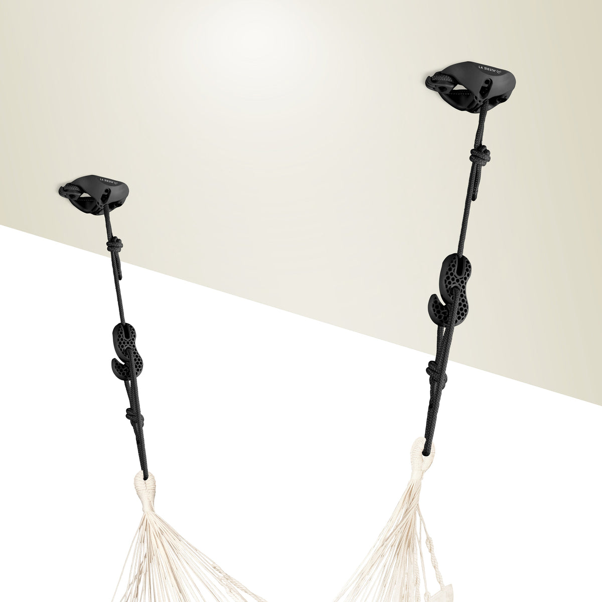 Two black CasaMount mounts fixed to a ceiling, holding a hammock