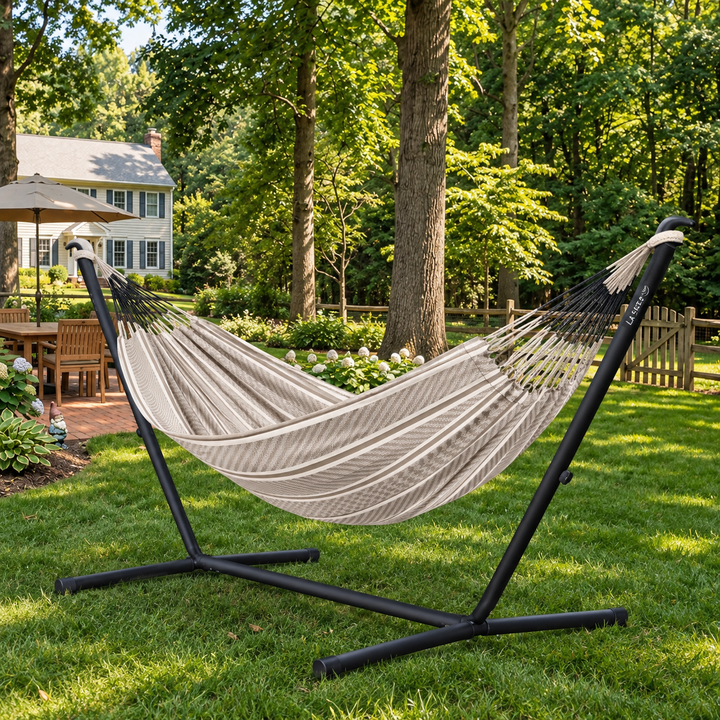 LA SIESTA Flora Zebra double hammock on a black Nautico stand on a garden lawn