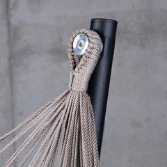 Taupe suspension loop on the top hook of the black Fiji stand