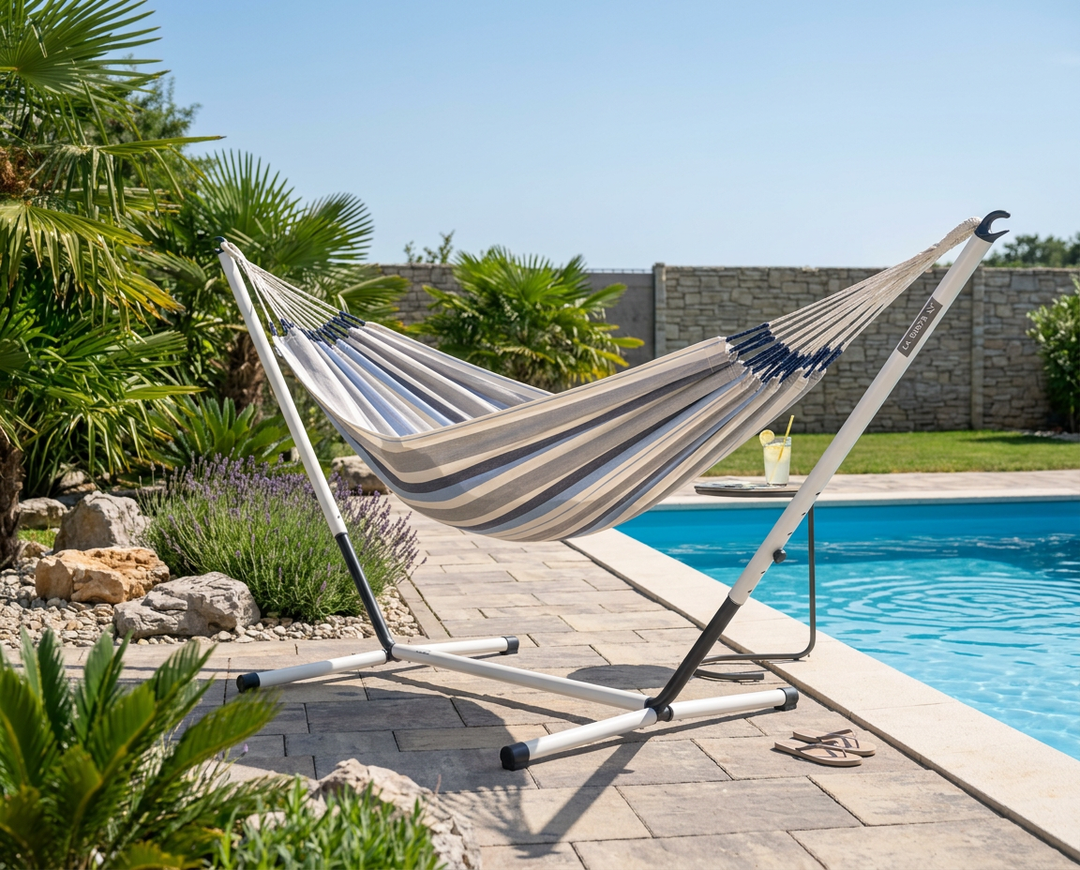 LA SIESTA Brisa Sea Salt double hammock on a Nautico Cool Grey stand beside a pool