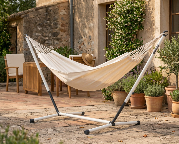 LA SIESTA Brisa Vanilla kingsize hammock on a Nautico Cool Grey stand on a stone patio