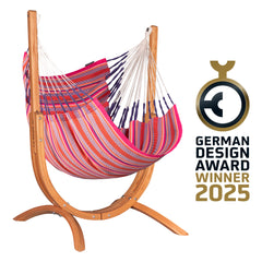 Udine Organic Flamingo hammock chair on a curved eucalyptus stand with German Design Award 2025 winner badge