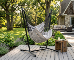 Black and cream striped LA SIESTA Cumbia Organic Zebra hammock chair on a black stand on a deck (stand sold separately)