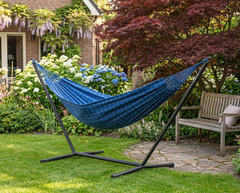 LA SIESTA Brisa Marine kingsize hammock on a black Nautico stand in a garden