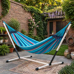LA SIESTA Brisa Wave kingsize hammock on a Nautico Cool Grey stand in a brick-walled courtyard