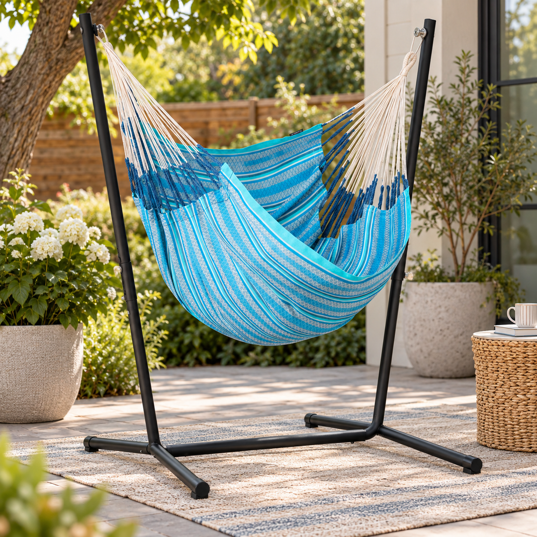 LA SIESTA Cumbia Organic Azure king size hammock chair on a black stand on a patio (stand sold separately)