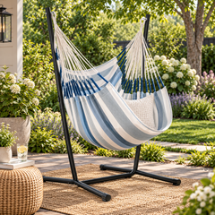 LA SIESTA Cumbia Outdoor Sea Salt king size hammock chair on a black stand in a garden (stand sold separately)
