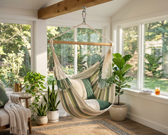 LA SIESTA Domingo Cedar hammock chair hanging in a bright sunroom with plants