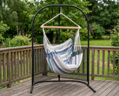 LA SIESTA Domingo Sea Salt hammock chair on a black arched stand on a wooden deck (stand sold separately)