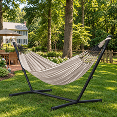 LA SIESTA Flora Zebra double hammock on a black Nautico stand on a garden lawn
